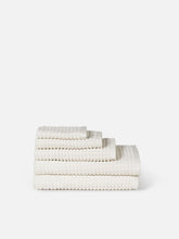Load image into Gallery viewer, Set of three textured towels in neutral colors on a white background