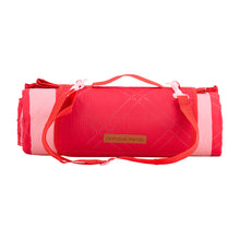Load image into Gallery viewer, Red and pink picnic mat shown rolled up and on a white background.