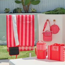 Load image into Gallery viewer, Pink and red striped picnic range, showing picnic mat unrolled and draped over glass panel.