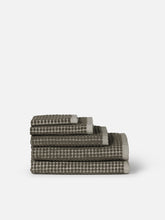 Load image into Gallery viewer, Stack of checkered towels on a white background
