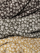 Load image into Gallery viewer, Stack of towels with floral patterns in brown, green, and yellow.